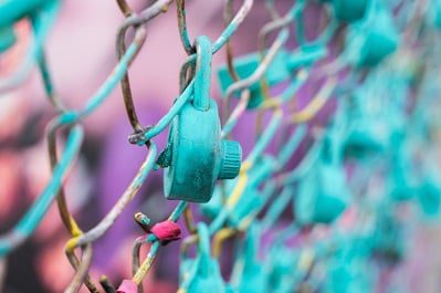 Chain link fence teal combination lock
