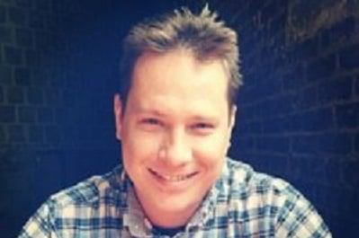 Up close man brown hair plaid shirt