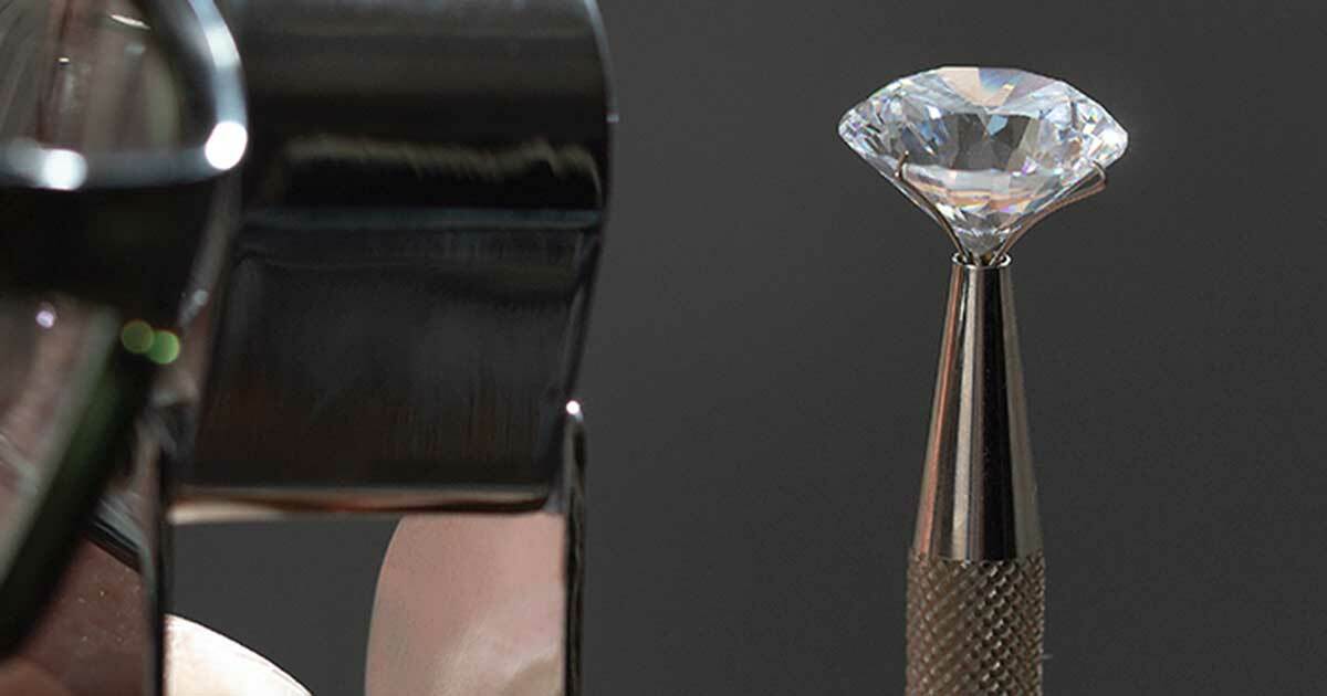 Diamond being examined up close by jeweler illustrating how careful to be when choosing a new penetration testing tool. Choosing the Right Modern Application Security Tools.