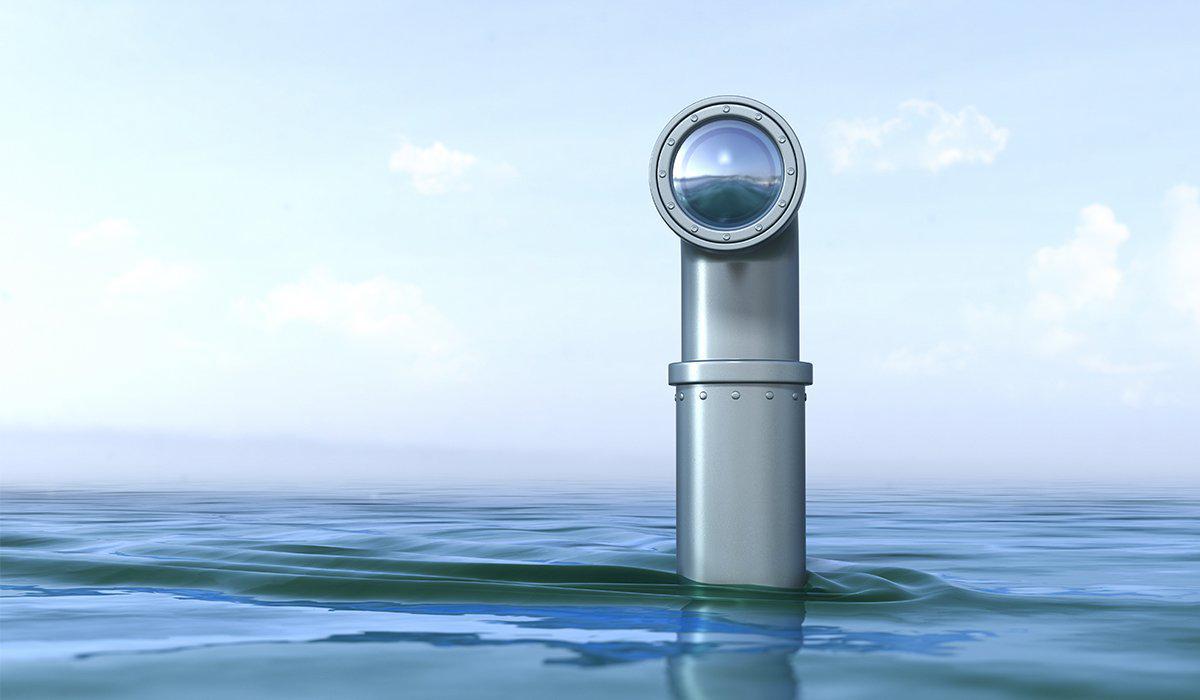 Periscope peering out from a body of water