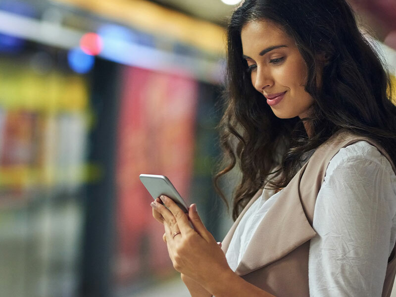 Bishop Fox case study on how Equifax works with Bishop Fox for continuous security testing for their external perimeter showing a woman looking at her cell phone. Equifax Employs Bishop Fox’s Cosmos (formerly CAST) for Continuous Security Testing.