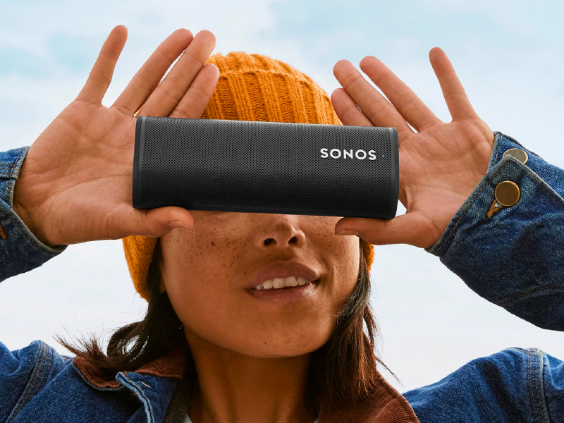 Women holding new Sonos speaker that Bishop Fox secured with hardware-based penetration tests. Sonos Makes Secure Moves with Bishop Fox.