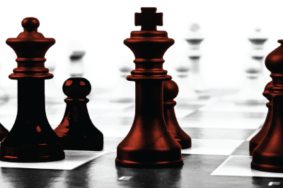 Red chess pieces on board